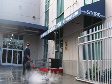 Pressure washing surface cleaning at a commercial property