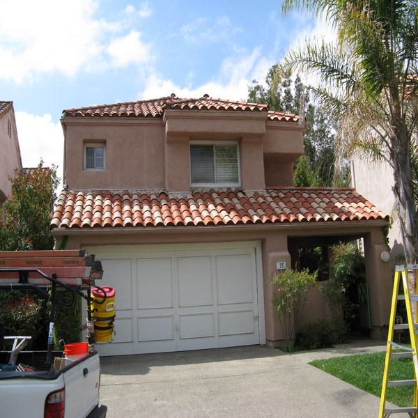 After roof cleaning photo showing refreshed terra cotta tile roof